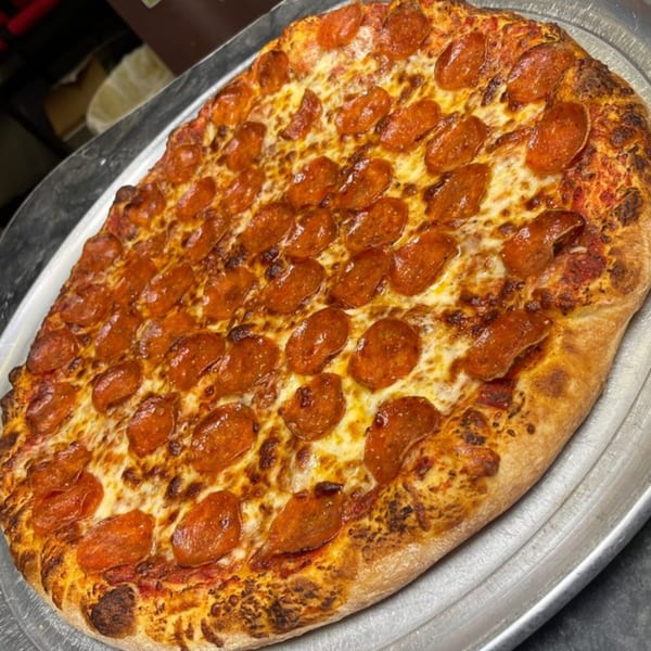 A freshly baked, large pepperoni pizza from Jack's Pizza & Subs on a metal tray.